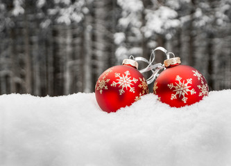 Two christmas balls in snow