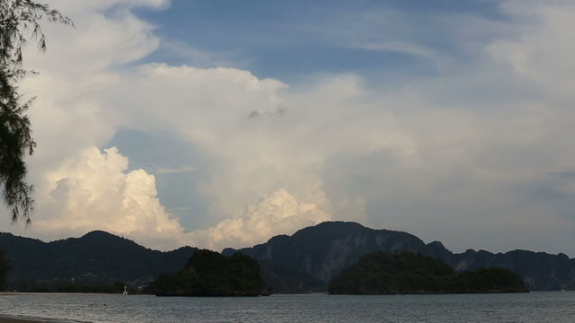 tide of the sea on the background of mountains and clouds
