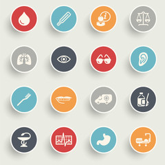 Medicine icons with color buttons on gray background.