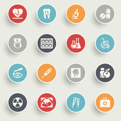 Medicine icons with color buttons on gray background.