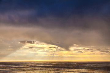 The sunbeam in evening sky and the North Sea