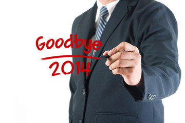 Businessman hand drawing goodbye 2014 on a whiteboard, isolated