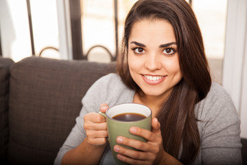 Happy girl enjoying coffee