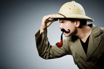 Man in safari hat in hunting concept