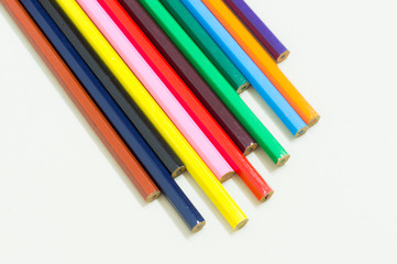 Colored pencils lined up in a row
