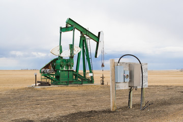 Fototapeta na wymiar A pumpjack in Alberta, Canada