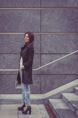 Fototapeta premium Pretty girl posing in the city streets