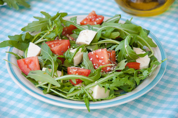 Greece salad with mozzarella, ruccola and tomatoes