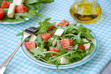Greece salad with mozzarella, ruccola and tomatoes