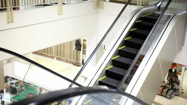 Moving escalator with stairs in big mall. HD. 1920x1080