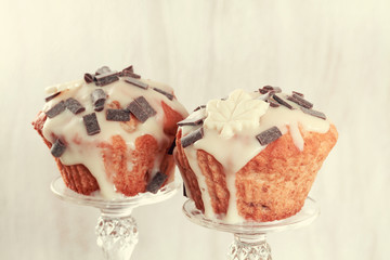 Delicious muffins with chocolate decoration. Toned image.