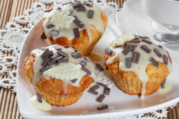 Delicious muffins with chocolate decoration