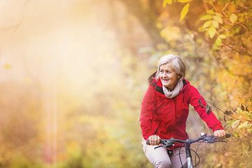 Active senior woman ridding bike