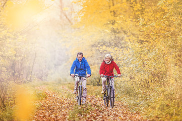 Active seniors ridding bike