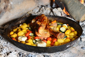Shank with potatoes in the oven