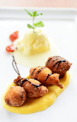 fritter cottage cheese balls on vanilla sauce and ice cream