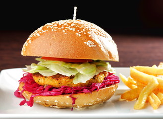 Fresh and fried vegetarian/fish burger with vegetables