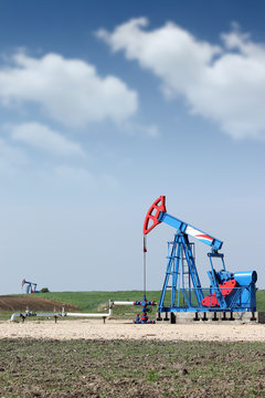 two oil pump jack on oilfield