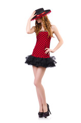 Young redhead girl in polka dot dress and  sombrero isolated on