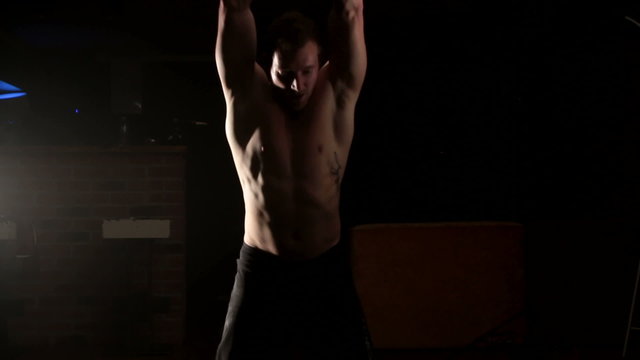 Man hitting flor with hammer