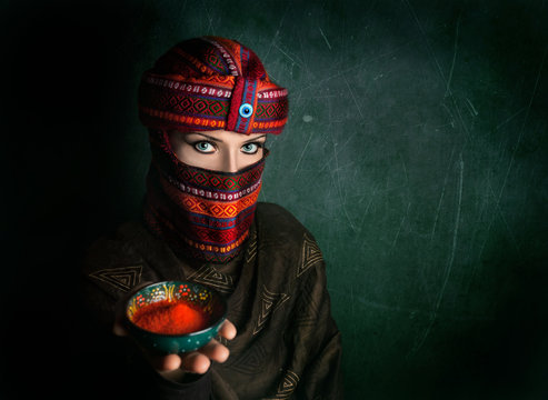 Woman in turban with red chili