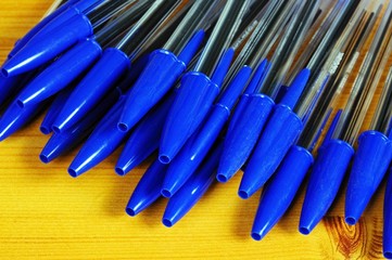 Blue pens with caps © Arena Photo UK