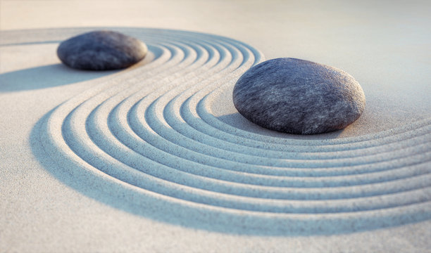 2 Steine und Wellen im Sand