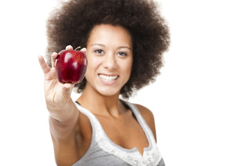 African American  young woman holding and showing a red apple