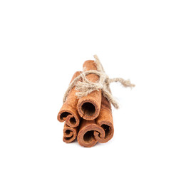 Bundle of cinnamon sticks on white background.
