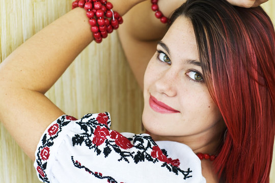 Beautiful Ukrainian girl in traditional embroidered shirt