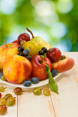image of various fruits on a green background