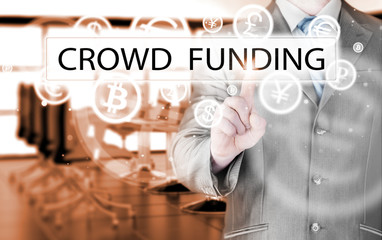 Businessman pushes virtual crowd funding button