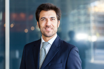 Fototapeta premium Handsome smiling business man portrait