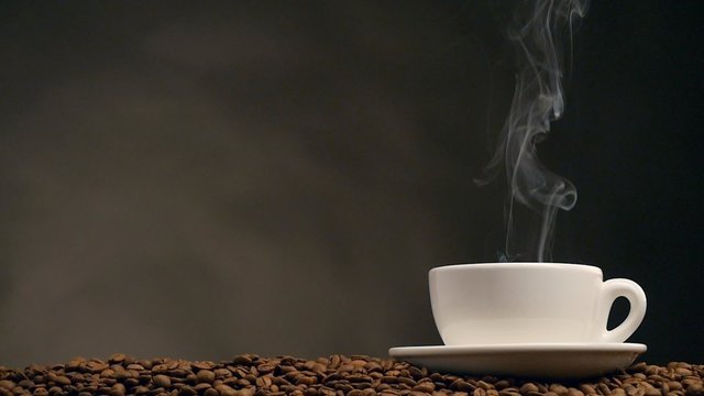 Cup of coffee on dark background