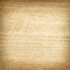 Light scratched square wooden cutting board.
