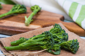 fresh green broccolini on table