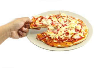 Hand holding piece of pizza isolated on white background