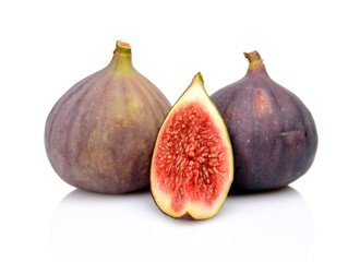 Three figs with quarter isolated on white background