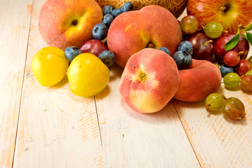 different fruits on green background