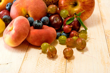 different fruits on green background