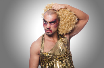 Man wearing woman clothing on white