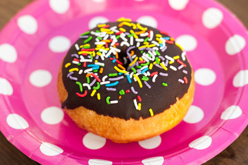 Bright donut on the plate