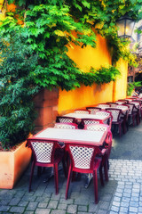 Fototapety  Cafe terrace in small European city