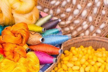 colorful silk thread and silkworm cocoons