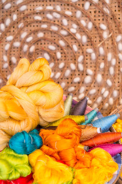 colorful silk thread and silkworm cocoons