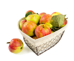 heart-shaped basket of apples