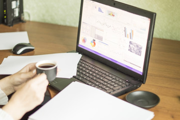 The process of with a laptop and documents