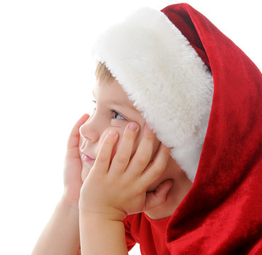 Cheerful boy in Santa Claus hat