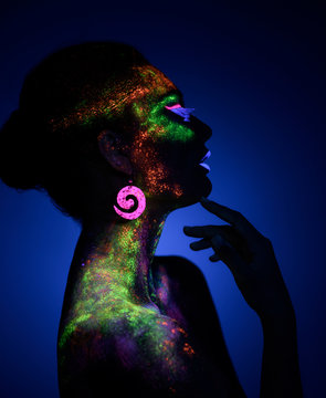 Woman Sensual Posing In Fluorescent Paint Makeup