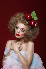 Artistry. Styled Woman with Two Apples on her Head